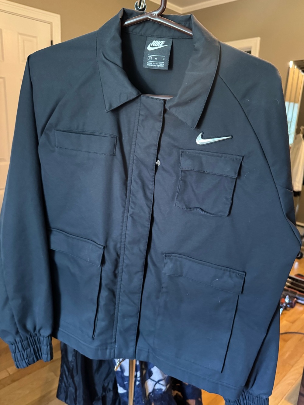 Women’s Nike Black Utility Jacket with Reflective Chrome Swoosh